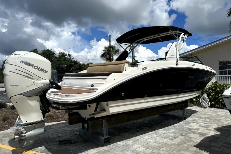 Slide: The Image of 2018 Sea Ray SDX 270 Outboard boat with Mercury engine on display. - 2