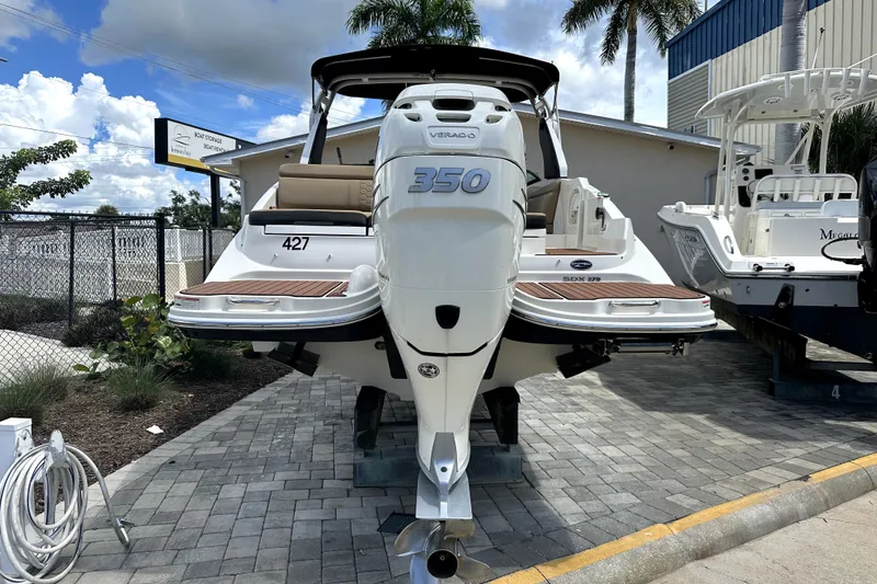 Slide: The Image of 2018 Sea Ray SDX 270 Outboard boat with powerful 350 engine, docked outdoors. - 5
