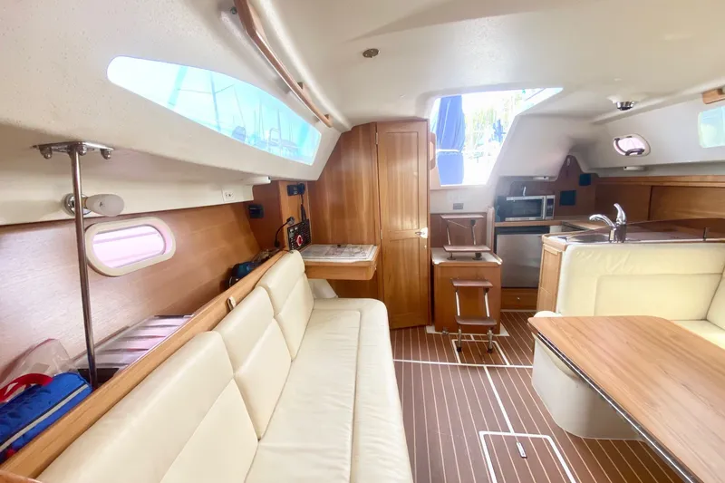 Slide: The Image of Interior of a 2007 Catalina 309 sailboat with wood finishes and modern amenities. - 27