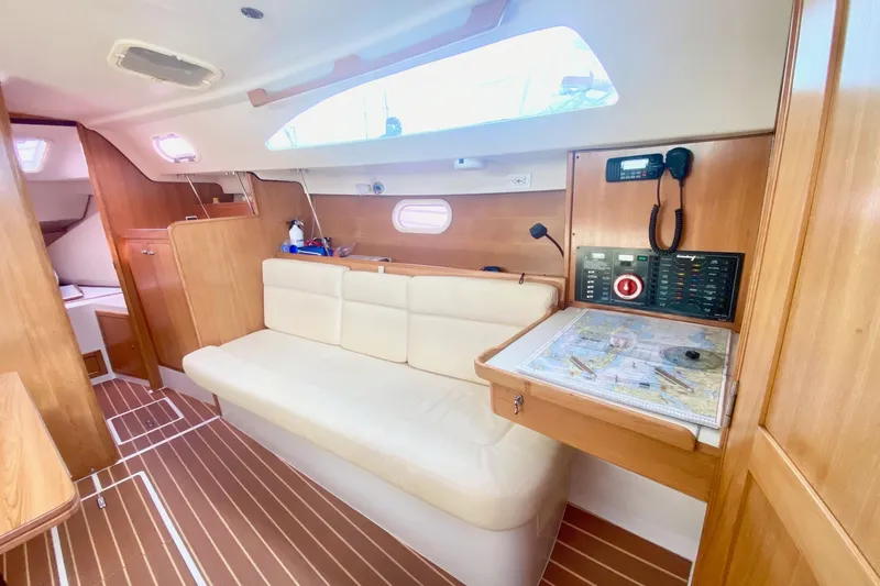 Slide: The Image of Interior of 2007 Catalina 309 sailboat with navigation station and comfortable seating. - 17