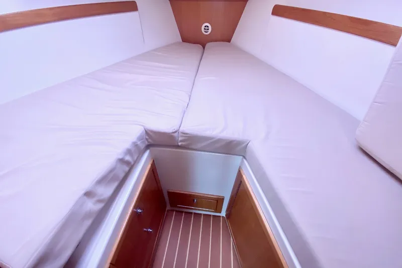 Slide: The Image of Interior cabin of a 2007 Catalina 309 sailboat with cushioned V-berth. - 12