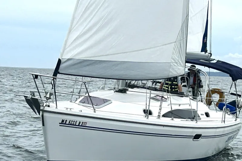 Slide: The Image of Sailing on open water, 2007 Catalina 309 yacht with white sails and blue trim. - 3
