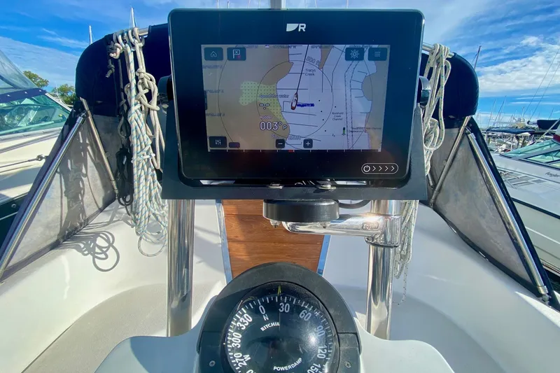 Slide: The Image of Catalina 309 sailboat cockpit with navigation display and compass, 2007 model. - 55