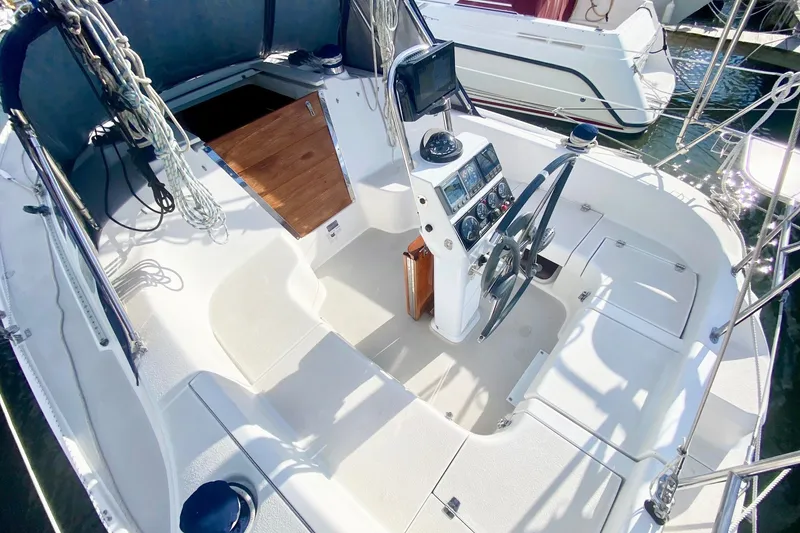 Slide: The Image of Cockpit of a 2007 Catalina 309 sailboat with steering wheel and navigation instruments. - 50