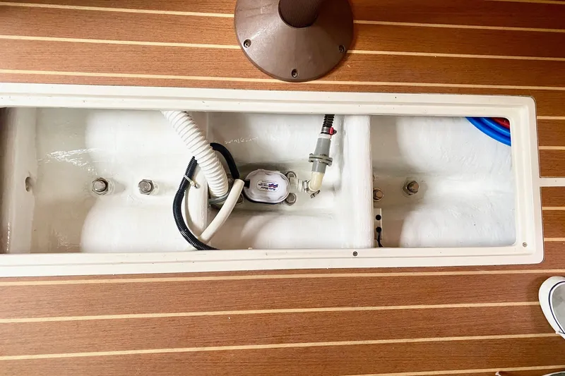 Slide: The Image of Interior view of a 2007 Catalina 309 sailboat, showcasing wiring and components. - 35