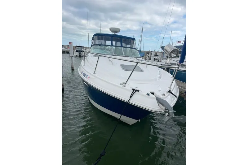 Slide: The Image of 2007 Chaparral Signature 330 boat docked in marina, overcast sky. - 2