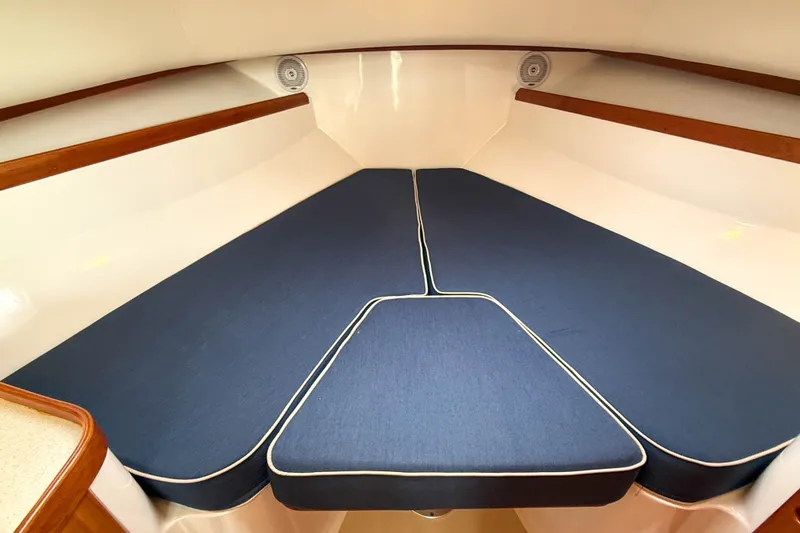 Slide: The Image of 2004 Hunt Yachts Surfhunter 29 interior cabin with blue cushioned seating. - 20