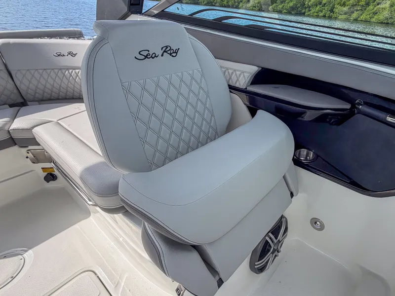Slide: The Image of The 2027 Sea Ray SLX 260 Outboard features luxurious, cushioned seats with a quilted design. - 16