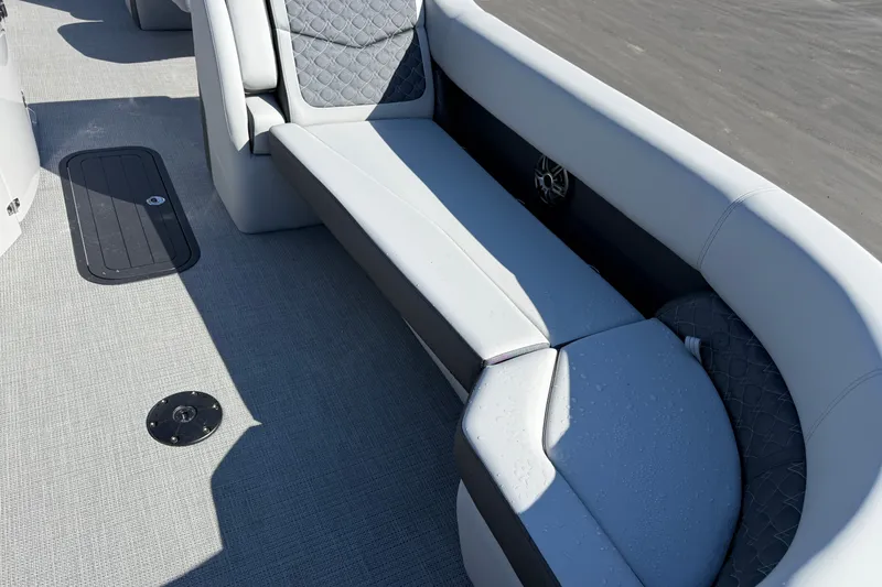 Slide: The Image of Luxurious seating on 2027 Manitou Encore 25 RF Dual pontoon boat, featuring quilted upholstery. - 8