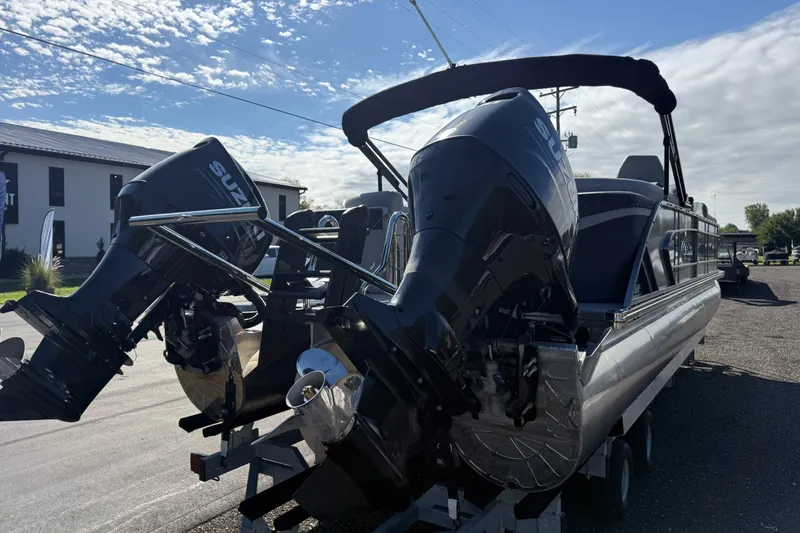 Slide: The Image of 2027 Manitou Encore 25 RF Dual pontoon boat with dual Suzuki outboard motors. - 5
