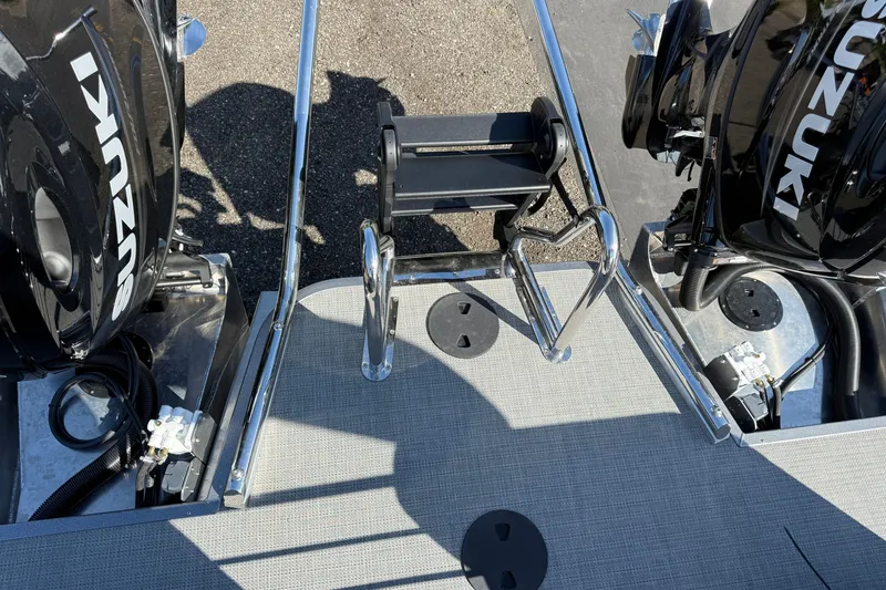 Slide: The Image of 2027 Manitou Encore 25 RF Dual boat with Suzuki engines and swim ladder. - 19