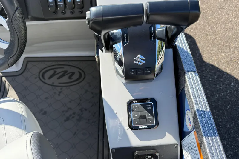 Slide: The Image of 2027 Manitou Encore 25 RF Dual boat controls with Suzuki throttle and steering wheel. - 13