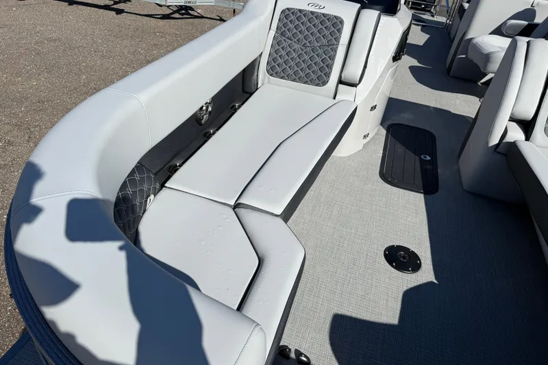 Slide: The Image of Luxurious seating on 2027 Manitou Encore 25 RF Dual pontoon boat, featuring elegant upholstery. - 7