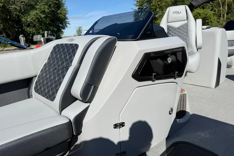 Slide: The Image of 2027 Manitou Encore 25 RF Dual boat interior with modern seating and sleek design. - 11