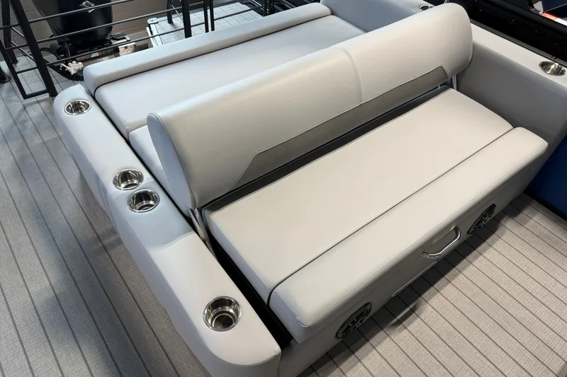 Slide: The Image of 2027 Manitou Encore SL 25 boat seating with cup holders and sleek design. - 22