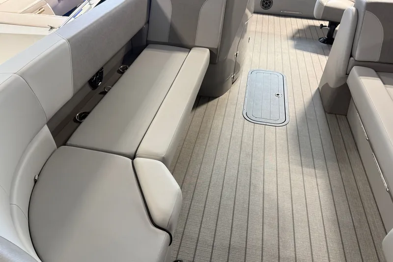 Slide: The Image of Luxurious interior of 2027 Manitou Encore SL 25 pontoon boat with plush seating. - 18