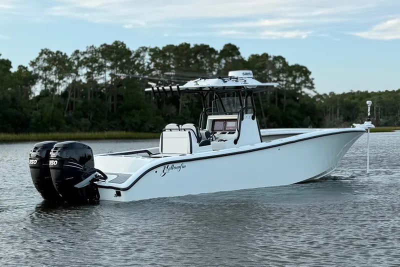 The Image of 2018 Yellowfin 32 Offshore boat with dual engines on calm water. - 1