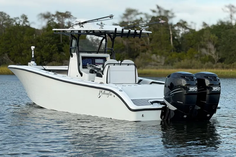 Slide: The Image of 2018 Yellowfin 32 Offshore boat with dual 350 horsepower engines on calm water. - 5