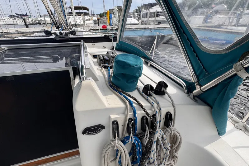 Slide: The Image of Sailboat cockpit with ropes and winches, CS 34 model, 1991, docked at marina. - 15