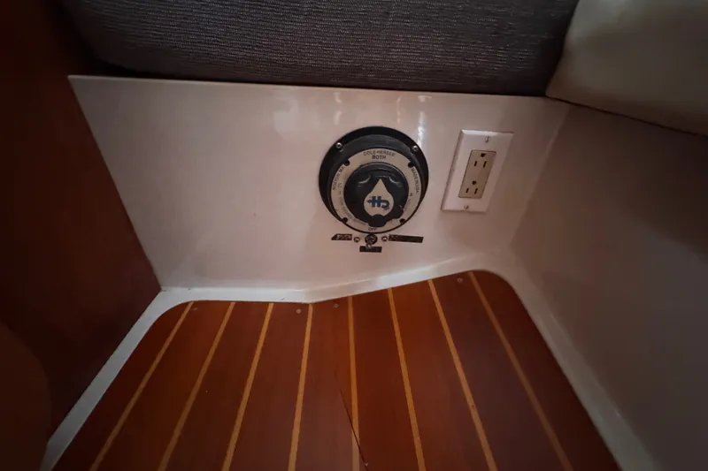 Slide: The Image of 1991 CS 34 interior showing electrical outlet and control panel on wooden floor. - 28