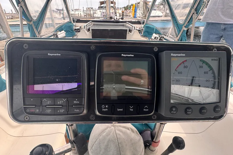 Slide: The Image of Sailboat cockpit with Raymarine navigation instruments, CS 34 model, 1991, docked at marina. - 18