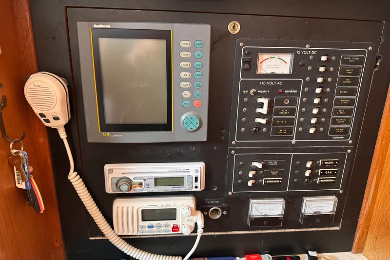 Slide: The Image of Control panel of a 1991 CS 34 boat with radar, radio, and electrical switches. - 34