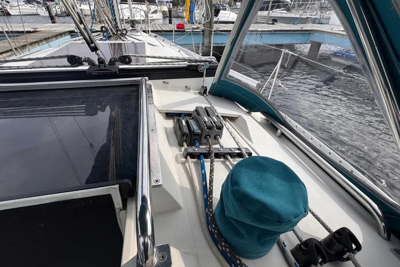 Slide: The Image of Cockpit view of a 1991 CS 34 sailboat docked at a marina. - 14