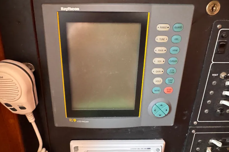 Slide: The Image of Raytheon RL9 LCD radar display with control panel on a 1991 CS 34 model. - 35