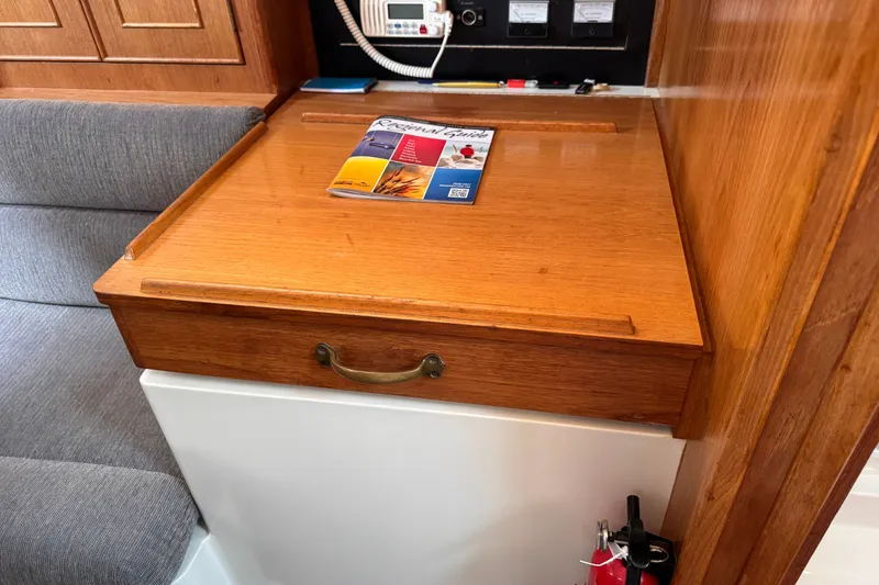 Slide: The Image of Wooden navigation station with brochure, CS 34 yacht, 1991 model. - 31