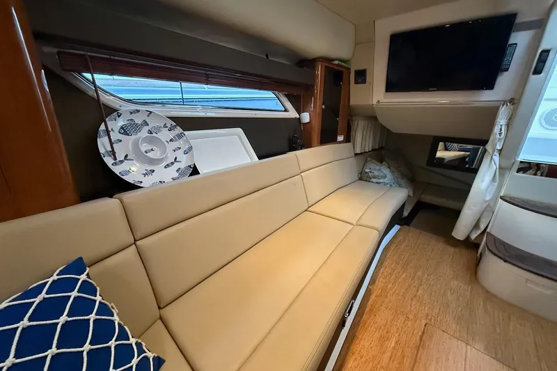 Slide: The Image of Interior of 2012 Regal 35 Sport Coupe with beige seating and modern decor. - 21