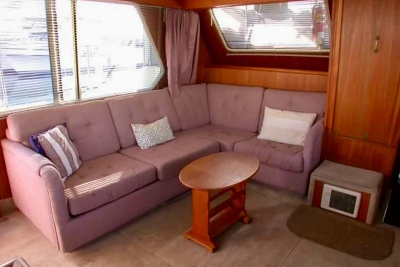 Slide: The Image of Interior of 1987 Tollycraft 44 Cockpit Motor Yacht with cozy seating area. - 9