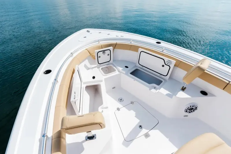 Slide: The Image of 2027 Sportsman Heritage 251 Center Console boat interior with seating and storage compartments. - 6