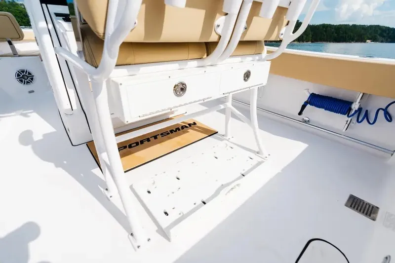 Slide: The Image of 2027 Sportsman Heritage 251 Center Console boat interior with seating and storage. - 11
