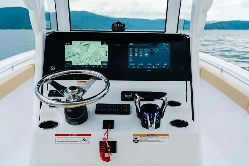 Slide: The Image of 2027 Sportsman Heritage 251 Center Console dashboard with navigation screens and steering wheel. - 8
