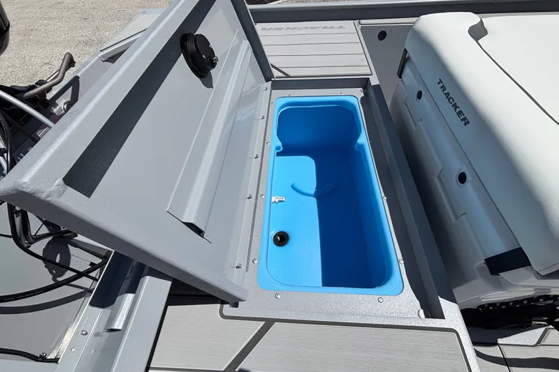 Slide: The Image of Open storage compartment on 2027 Tracker Bass Tracker Classic CC boat. - 14