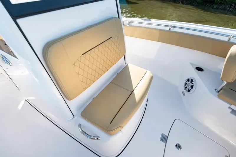 Slide: The Image of 2027 Sportsman Open 252 Center Console boat with tan seating and sleek design. - 5