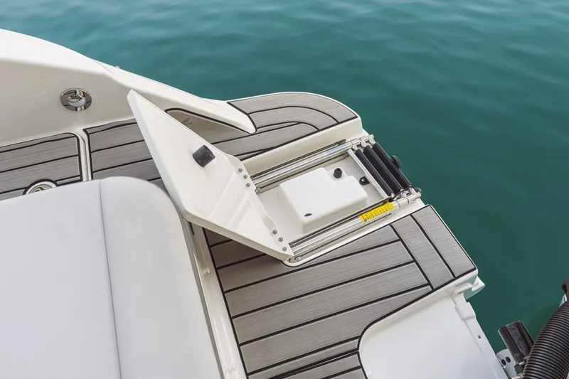 Slide: The Image of The image shows the stern of a Sea Ray SDX 270 Outboard with an integrated swim platform. - 43