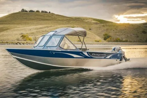 The Image of 2027 Duckworth 20 Advantage boat cruising on a scenic lake at sunset. - 1