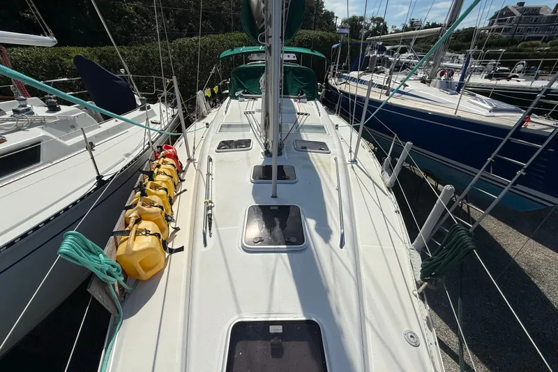 Slide: The Image of 2003 Beneteau Oceanis Clipper 393 sailboat docked, featuring deck and rigging details. - 4