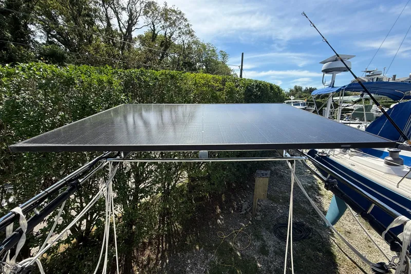 Slide: The Image of Solar panel on a 2003 Beneteau Oceanis Clipper 393 sailboat, docked outdoors. - 13