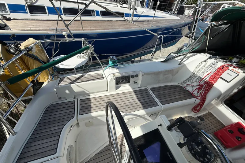Slide: The Image of Cockpit of 2003 Beneteau Oceanis Clipper 393 sailboat with steering wheel and seating. - 11