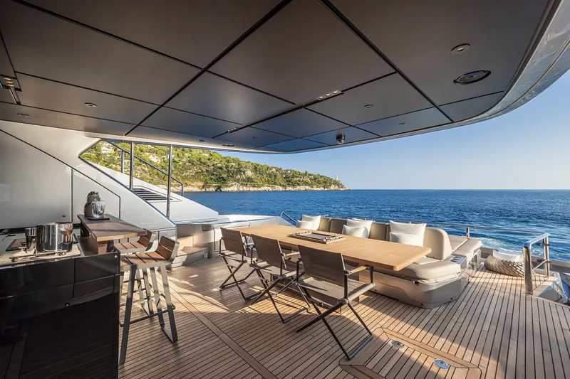 Slide: The Image of Luxurious 2026 Pershing GTX116 yacht deck with ocean view and elegant seating area. - 14