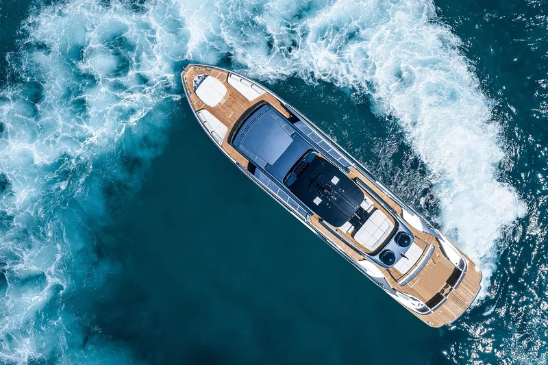 Slide: The Image of Aerial view of 2026 Pershing GTX116 yacht cruising through blue ocean waters. - 6
