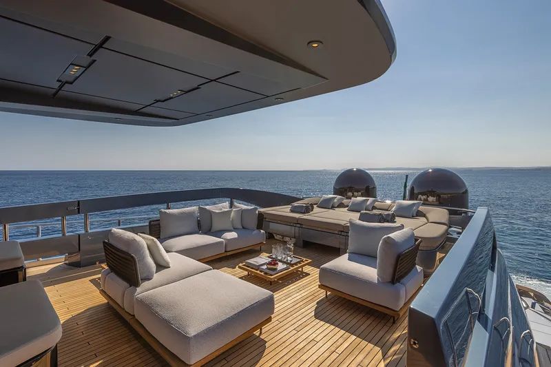Slide: The Image of Luxurious deck of 2026 Pershing GTX116 yacht with elegant seating and ocean view. - 12