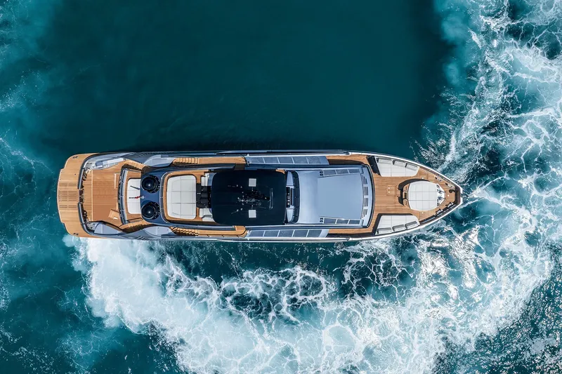 Slide: The Image of Aerial view of 2026 Pershing GTX116 yacht cruising in blue ocean waters. - 5