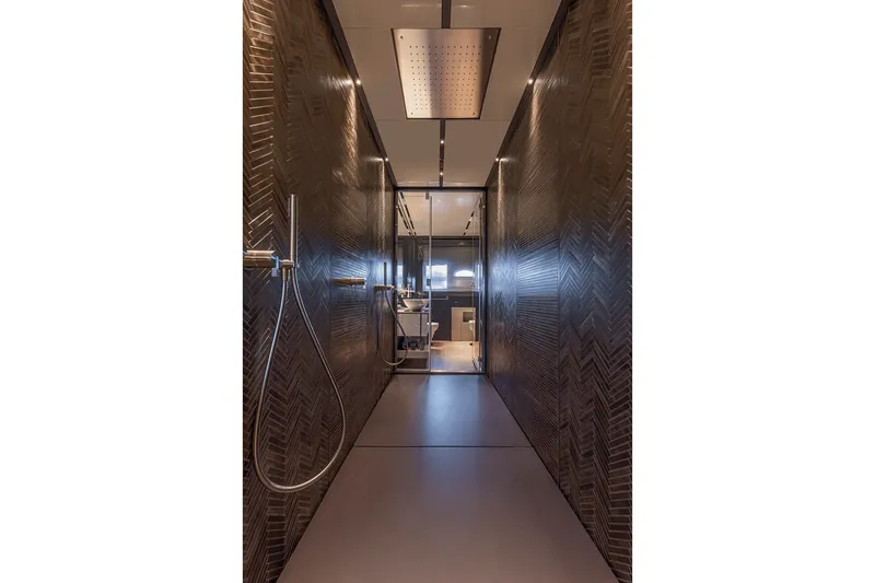 Slide: The Image of Luxurious interior of 2026 Pershing GTX116 yacht with modern shower design. - 23