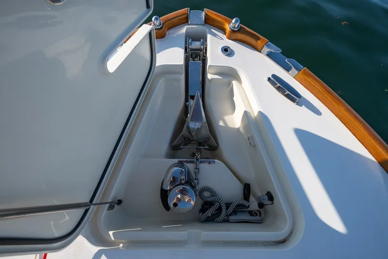 Slide: The Image of Anchor compartment of 2008 Hinckley Talaria 29R boat with polished metal fittings. - 11