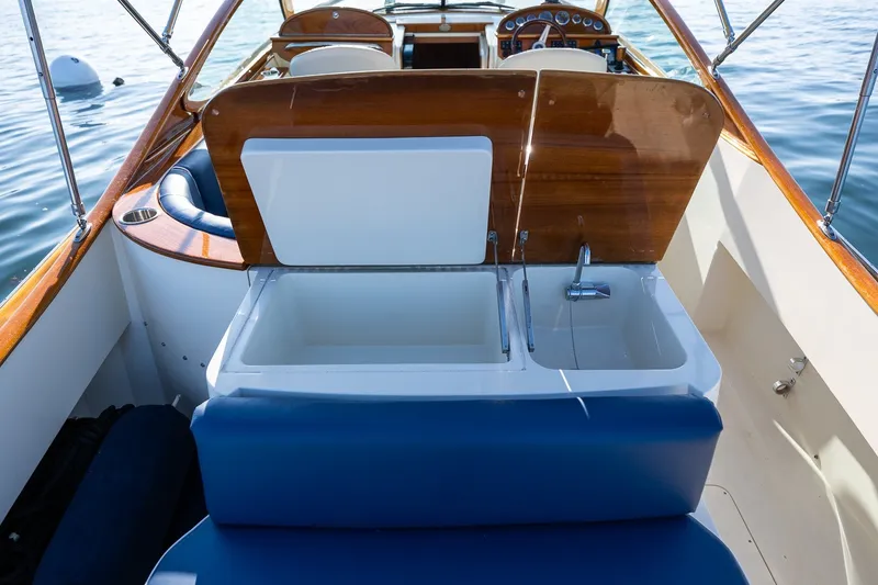 Slide: The Image of 2008 Hinckley Talaria 29R boat interior with sink and seating area. - 31