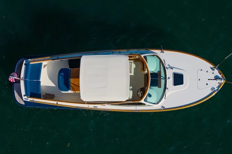 Slide: The Image of Aerial view of 2008 Hinckley Talaria 29R boat on clear water. - 3