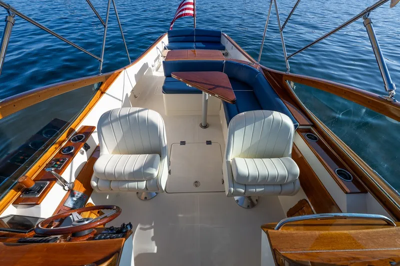 Slide: The Image of Hinckley Talaria 29R 2008 boat interior with elegant seating and wooden accents. - 16